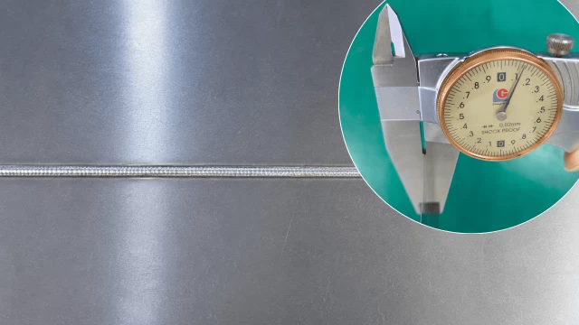 0.15 mm ultra-thin stainless steel laser welding test showing the weld seam and thickness measurement